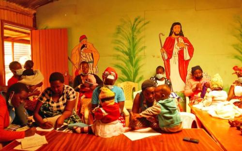 Mothers participate in a group meeting.